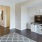 a living room with a tv and a rug