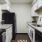 a kitchen with white cabinets