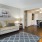 A living room with a rug and decor